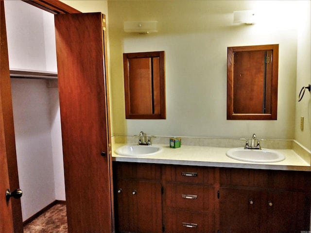 bathroom featuring double vanity and tile floors