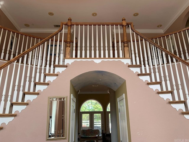 interior space featuring french doors and ornamental molding