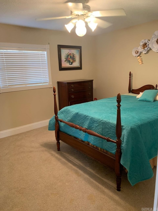 bedroom with light carpet and ceiling fan