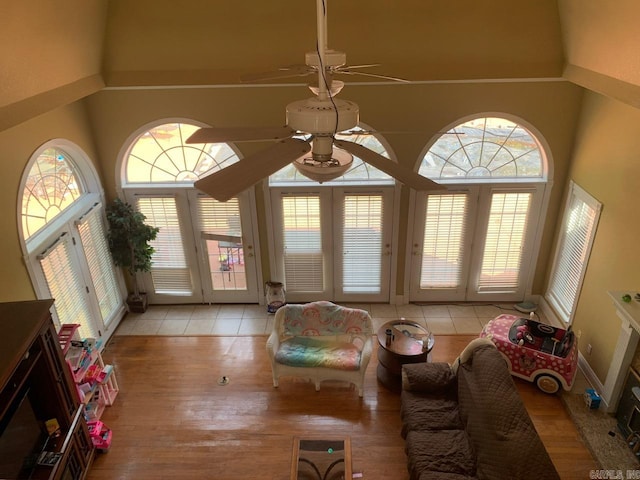 living room with ceiling fan and a wealth of natural light