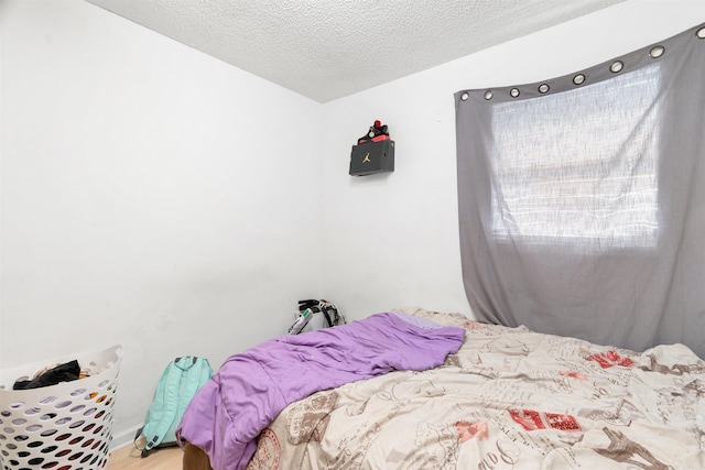 bedroom featuring a textured ceiling