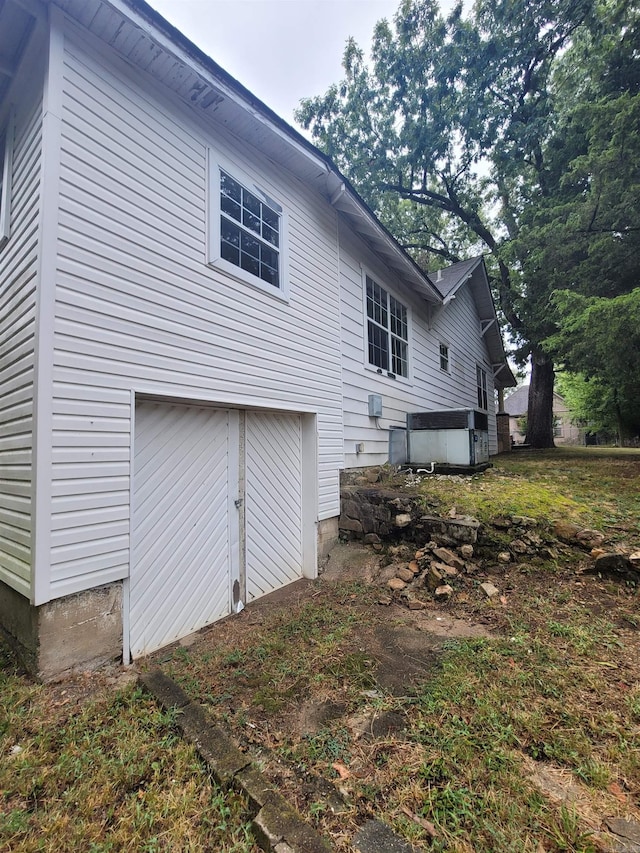 back of property featuring a garage