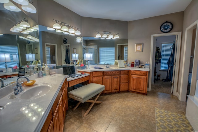 bathroom with tile floors and vanity