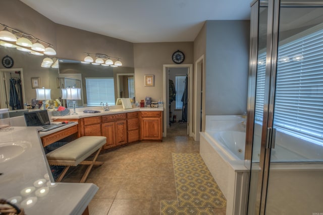 bathroom with dual sinks, tile flooring, large vanity, and a relaxing tiled bath