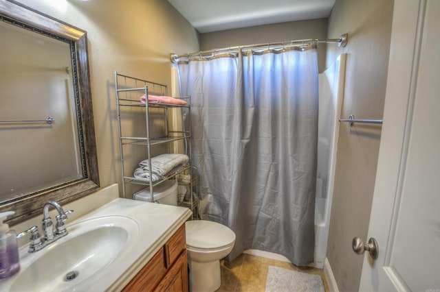 bathroom with toilet, vanity, and tile flooring