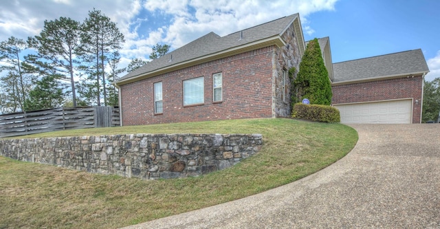 view of property exterior featuring a lawn and a garage