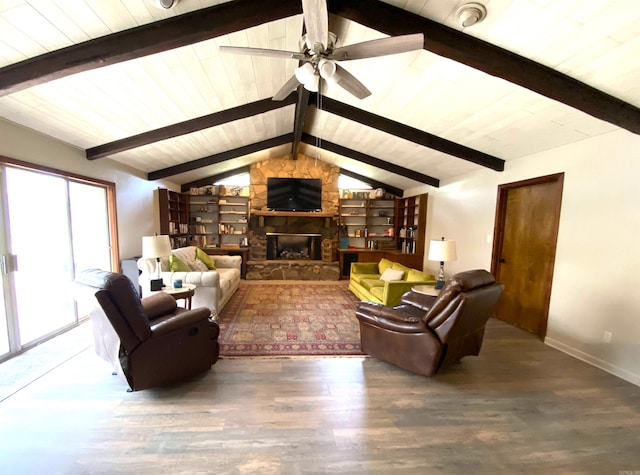 living room featuring a stone fireplace, built in features, wood-type flooring, ceiling fan, and lofted ceiling with beams