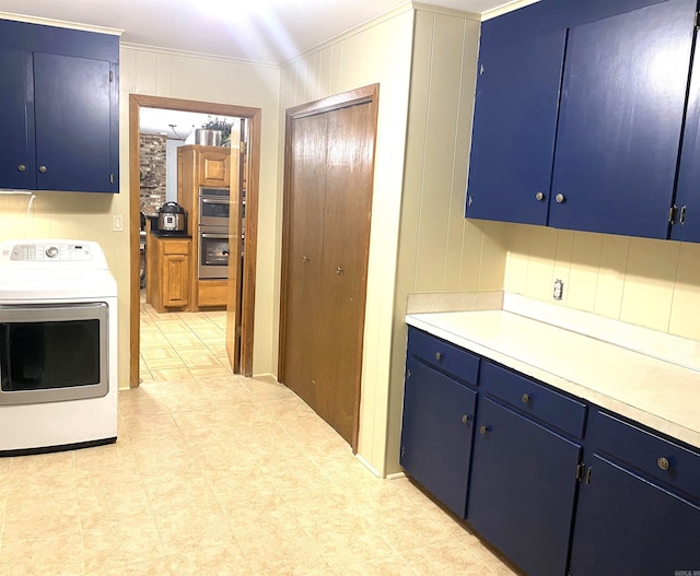 kitchen featuring blue cabinets, crown molding, washer / clothes dryer, and light tile flooring