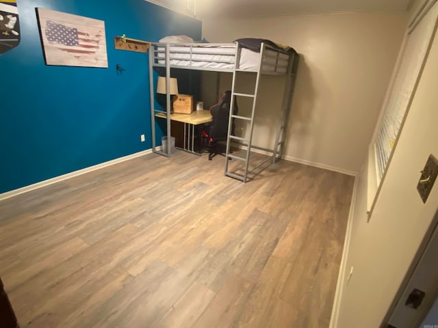 bedroom with hardwood / wood-style floors