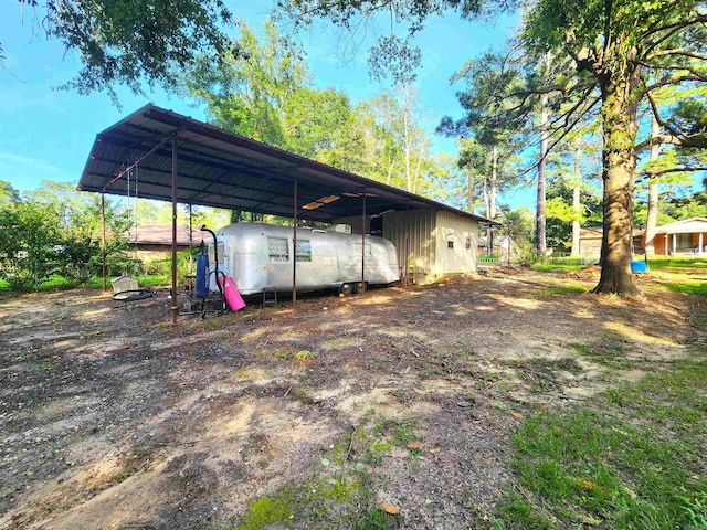 view of yard with a carport