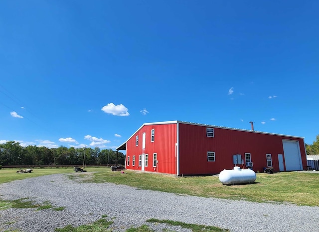 view of shed / structure with a lawn