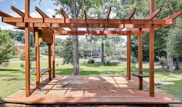 exterior space with a lawn, a deck, and a pergola