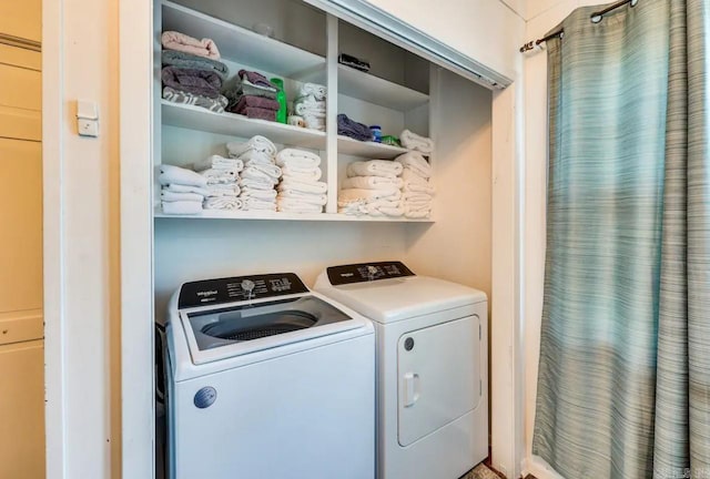 washroom featuring washing machine and dryer