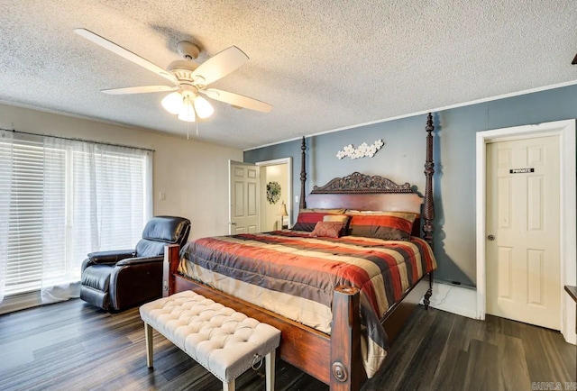 bedroom featuring ceiling fan, dark wood-type flooring, and a textured ceiling