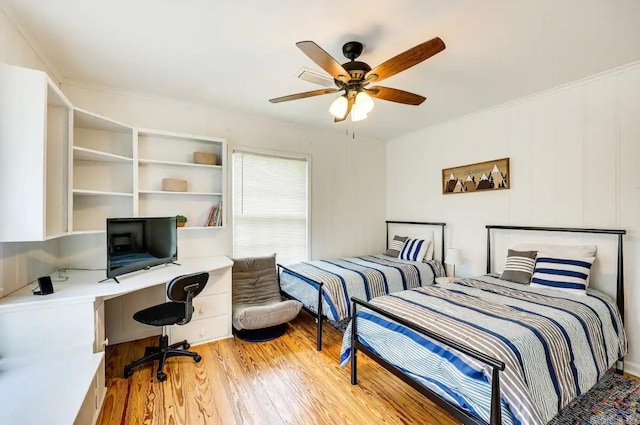 bedroom with ceiling fan and light hardwood / wood-style flooring