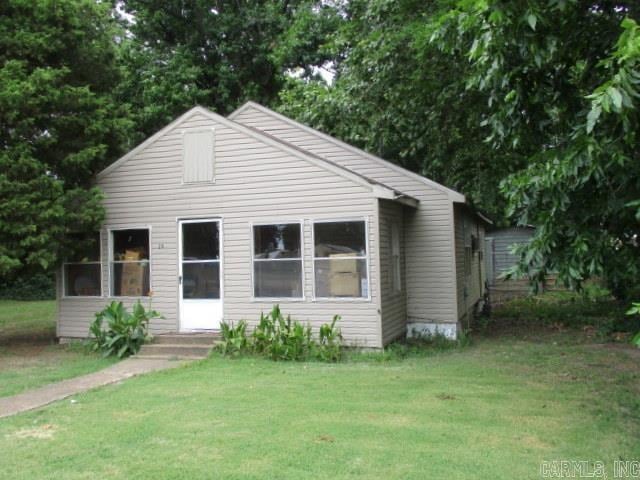 bungalow with a front lawn