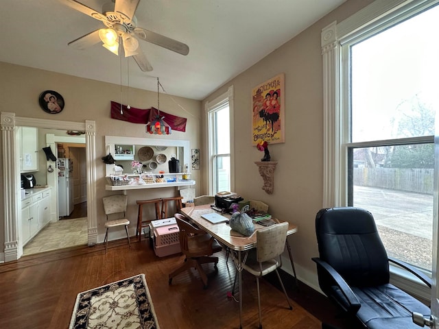 tiled dining area with ceiling fan