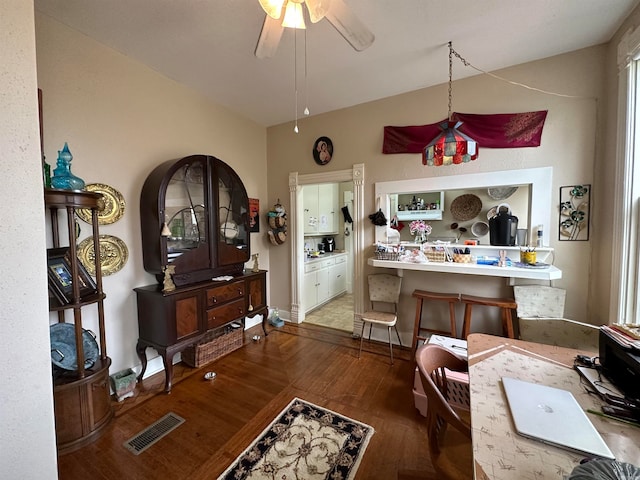 interior space with dark hardwood / wood-style floors and ceiling fan