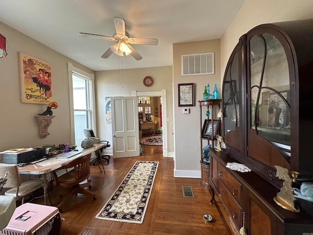 interior space with ceiling fan and dark wood-type flooring