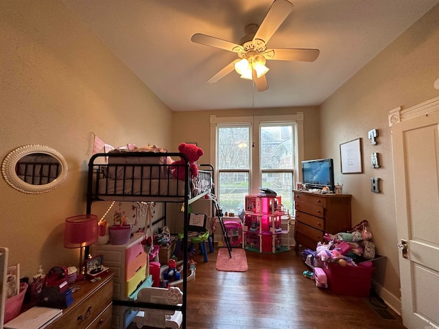 bedroom with ceiling fan and dark hardwood / wood-style flooring