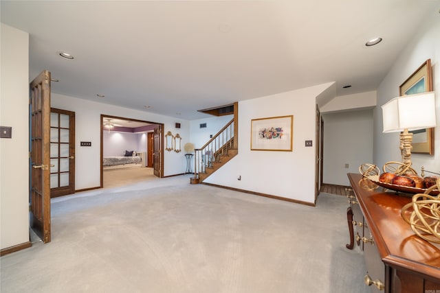 living room with light colored carpet and ceiling fan