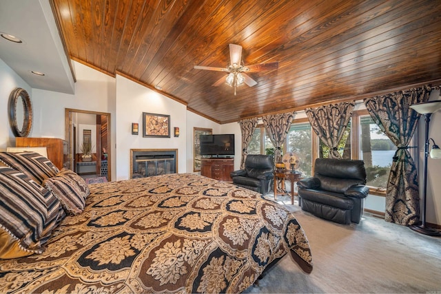 carpeted bedroom featuring ceiling fan, vaulted ceiling, ensuite bathroom, and wooden ceiling