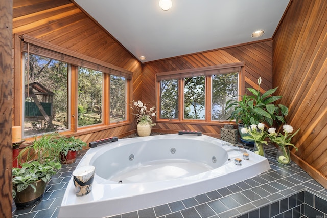 bathroom featuring wood walls and vaulted ceiling