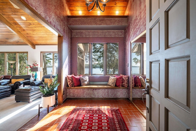 interior space featuring beam ceiling, wood ceiling, and a chandelier