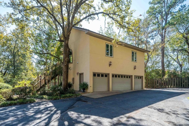 view of side of property with a garage