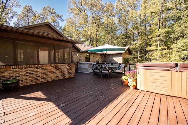 wooden terrace featuring a hot tub