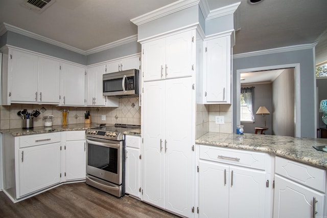 kitchen featuring white cabinetry, dark hardwood / wood-style floors, tasteful backsplash, and stainless steel appliances