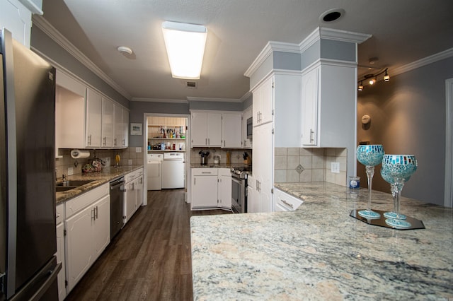 kitchen featuring backsplash, dark hardwood / wood-style floors, stainless steel appliances, and white cabinets