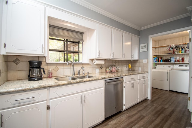 kitchen with washing machine and dryer, white cabinetry, dark hardwood / wood-style floors, sink, and stainless steel dishwasher