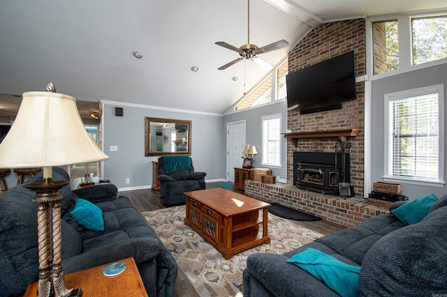 living room with a fireplace, brick wall, vaulted ceiling, ceiling fan, and dark wood-type flooring