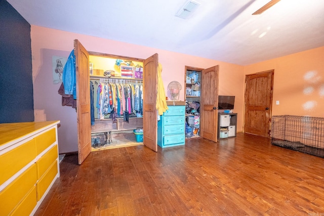 bedroom featuring ceiling fan, hardwood / wood-style flooring, and a closet