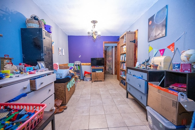 rec room with light tile floors and a notable chandelier