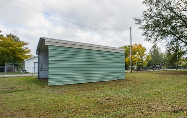 view of shed / structure with a yard