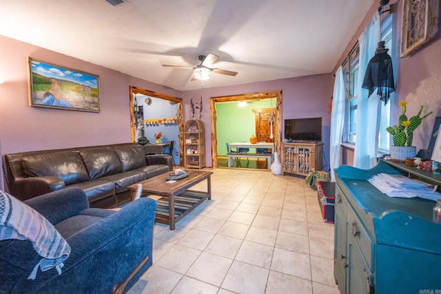 living room with ceiling fan and light tile flooring