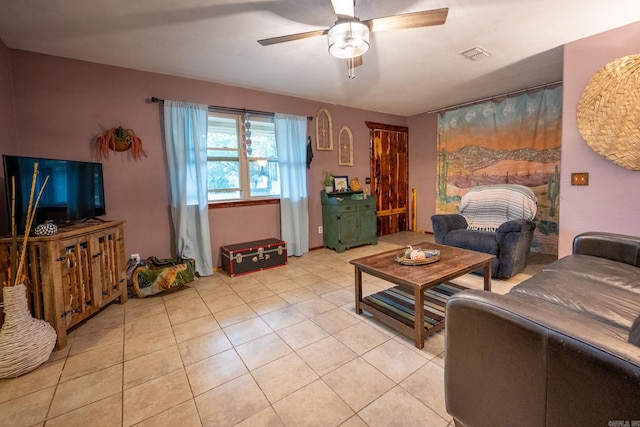 living room featuring ceiling fan and light tile floors