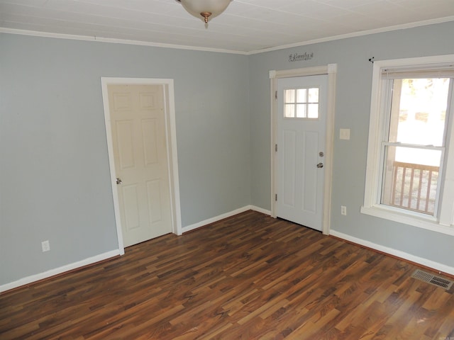 foyer entrance featuring dark wood-type flooring and ornamental molding