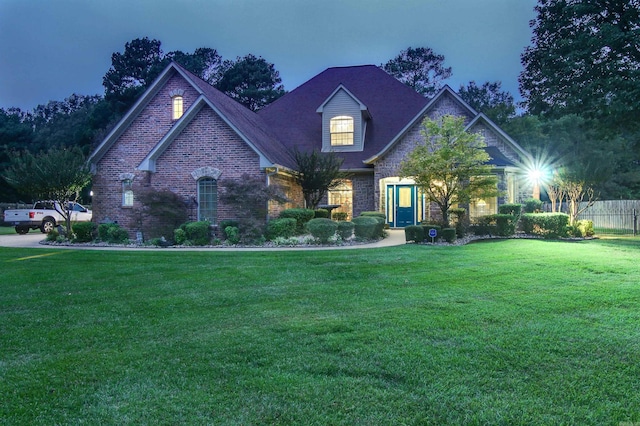 view of front of home with a lawn