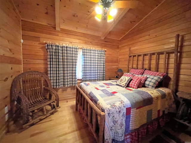 bedroom featuring lofted ceiling with beams, ceiling fan, wooden ceiling, and wood walls