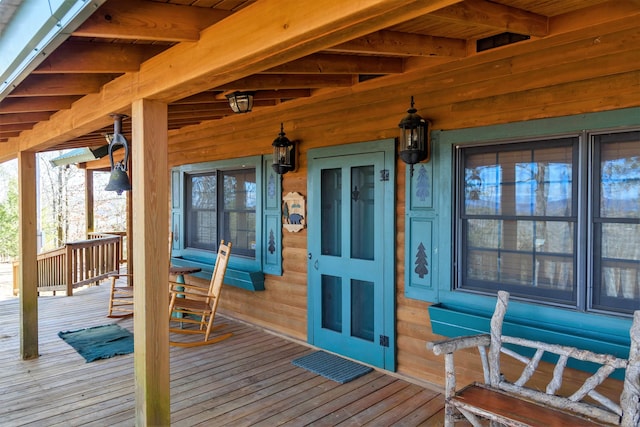 wooden deck featuring covered porch