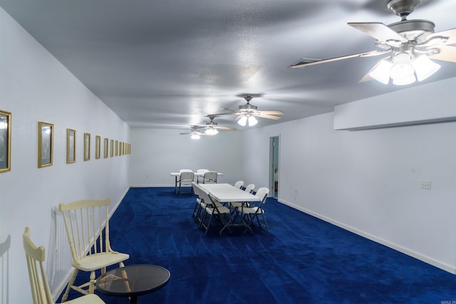 dining space featuring dark carpet
