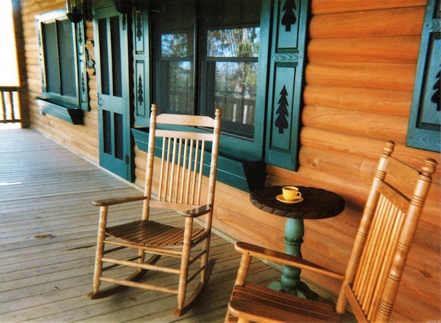 wooden terrace featuring a porch