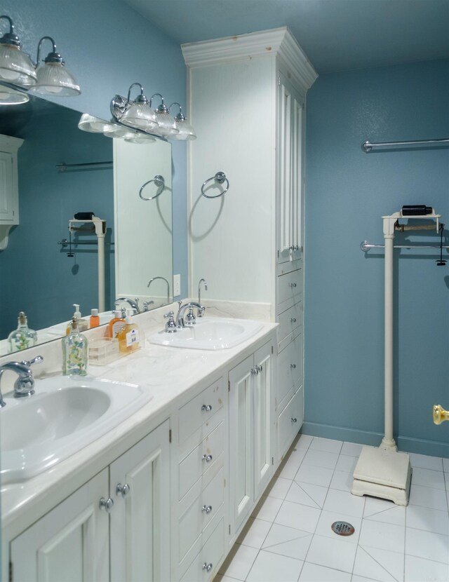 bathroom featuring tile patterned flooring and vanity