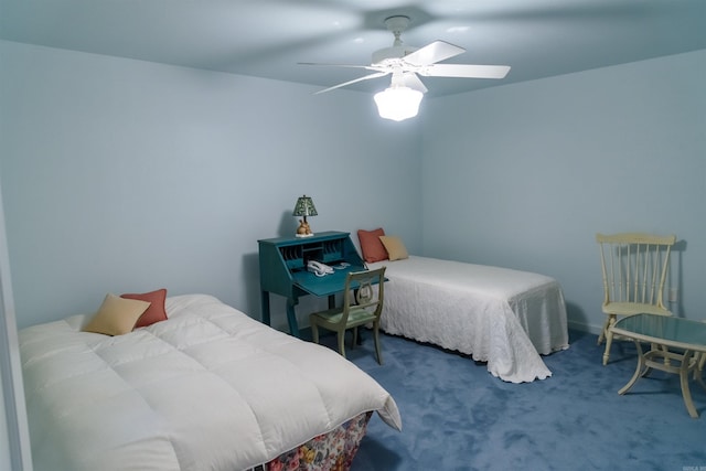 bedroom with ceiling fan and dark carpet