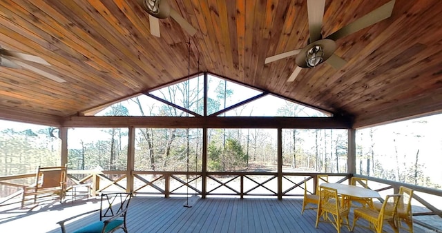 unfurnished sunroom with ceiling fan, wooden ceiling, and vaulted ceiling