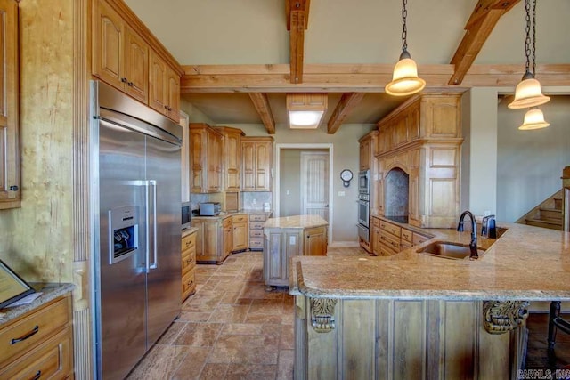 kitchen featuring a kitchen island, built in appliances, beamed ceiling, light stone countertops, and sink