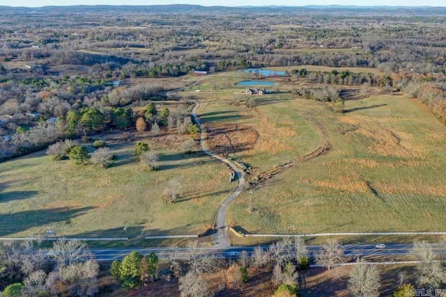 birds eye view of property featuring a rural view